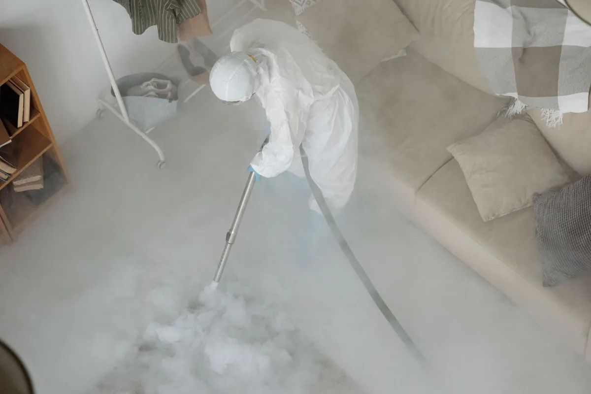 Biohazard cleanup technician in protective equipment, Grayson, CA